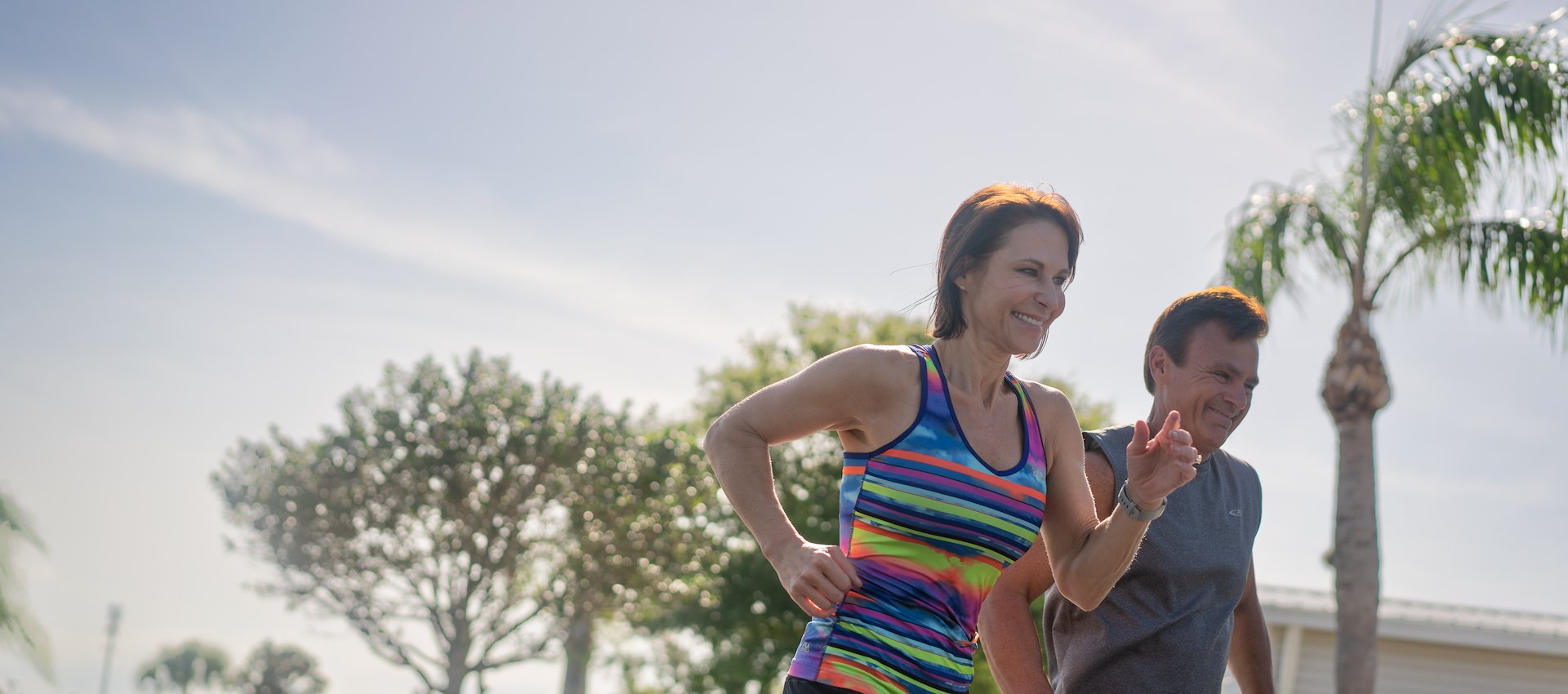 Two people running outside
