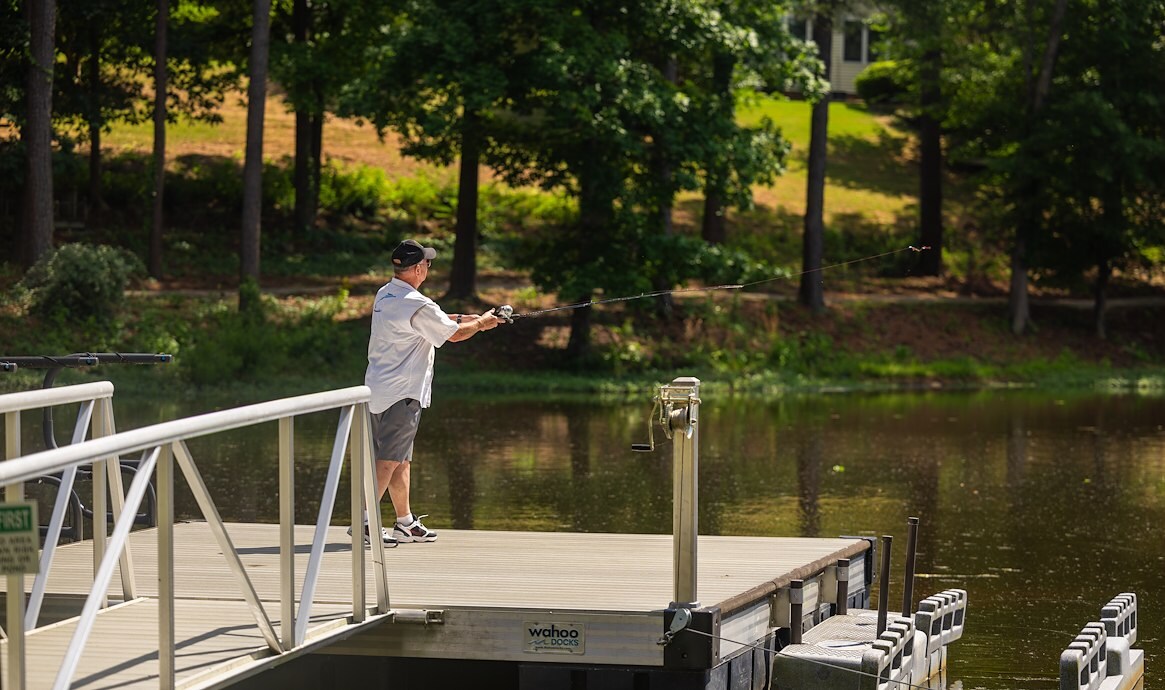 Person fishing off a dock