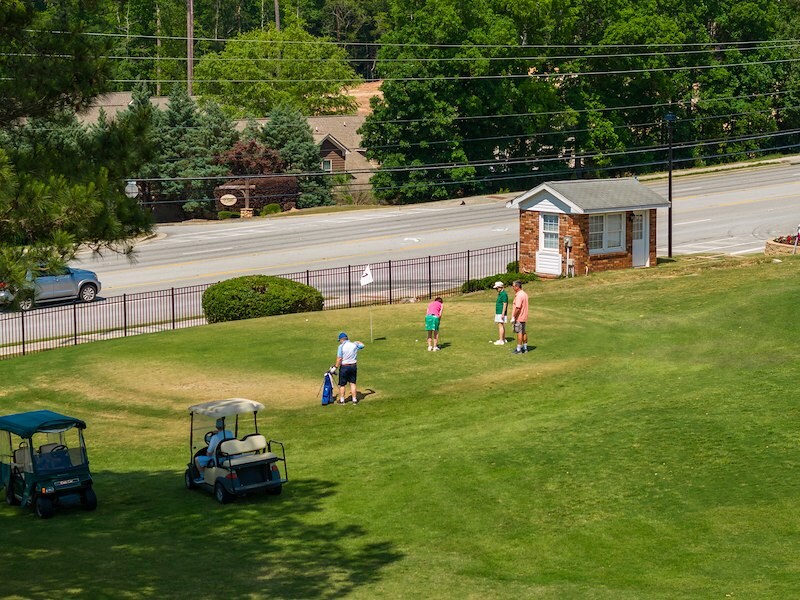 Golf course with a small group golfing