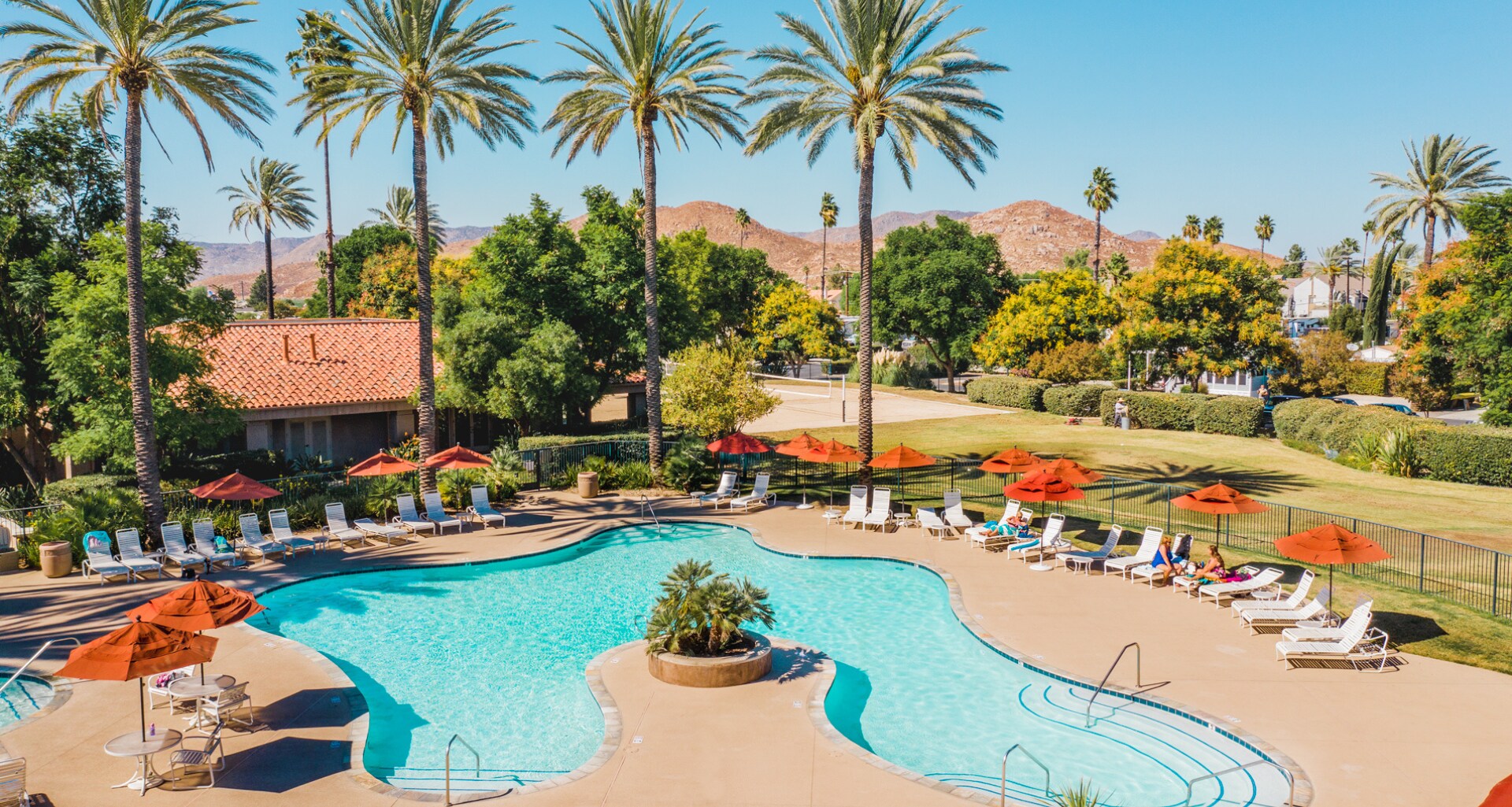 Pool view of blue water in Golden Village Palms RV Resort - Hemet California
