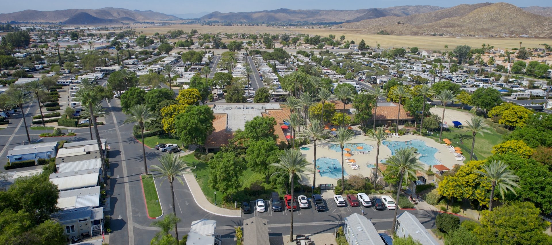 Pool view of blue water in Golden Village Palms RV Resort - Hemet California
