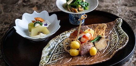 A plate with food on it and a bowl of fruit, The Kitano Hotel New York