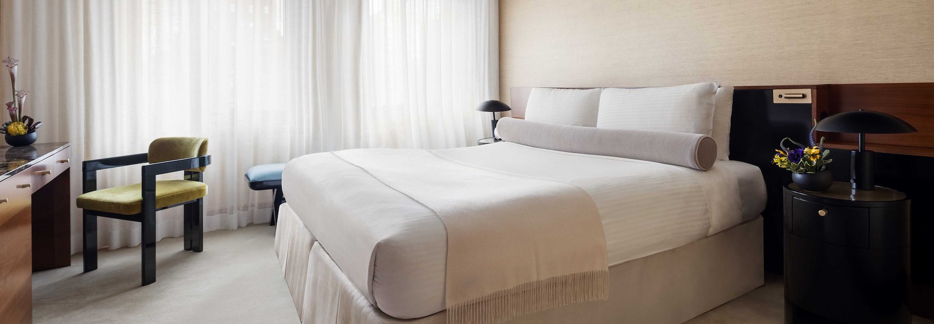 A hotel room with a bed, desk and chair, The Kitano Hotel New York