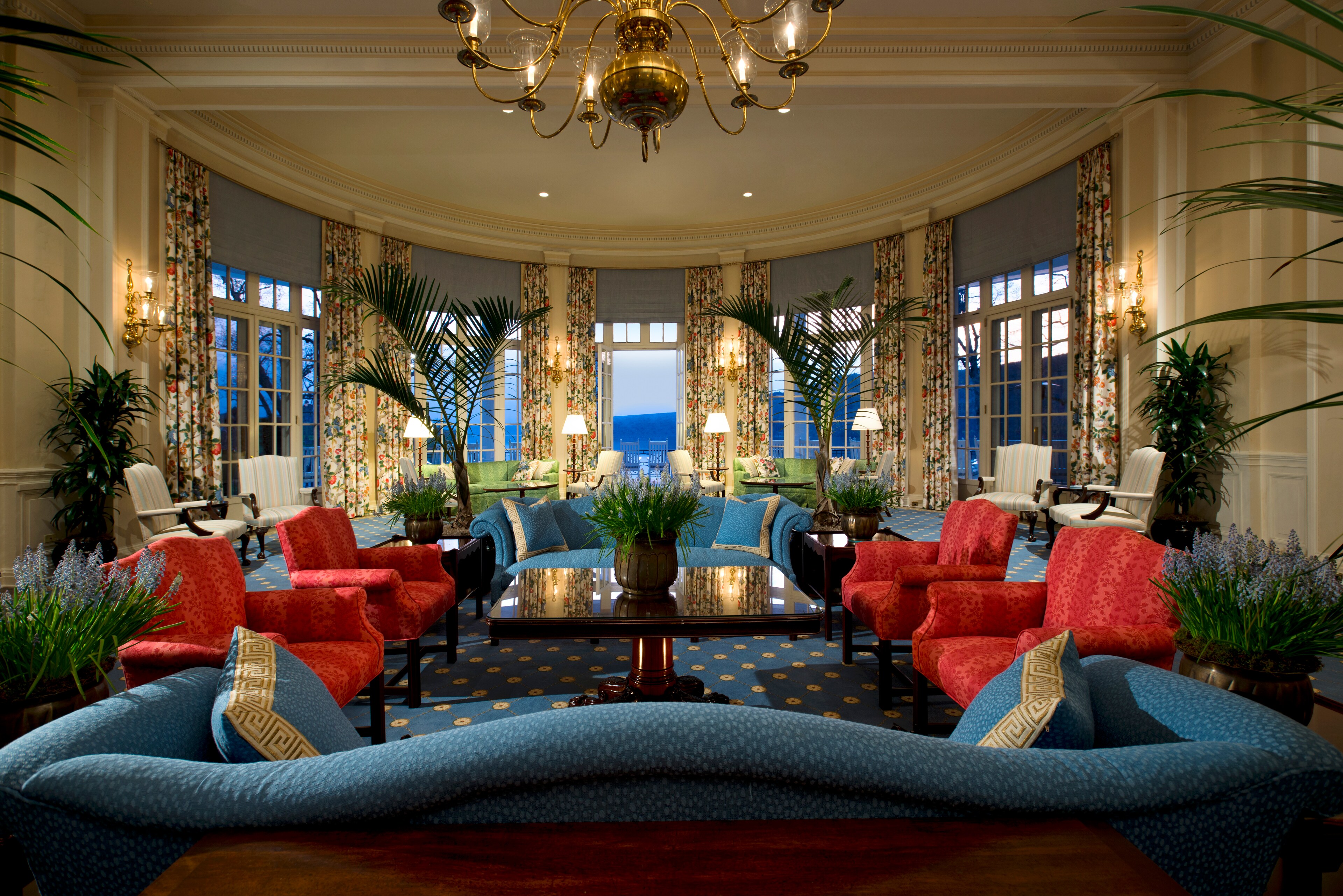 A richly decorated hotel lobby at The Otesaga Resort Hotel, New York