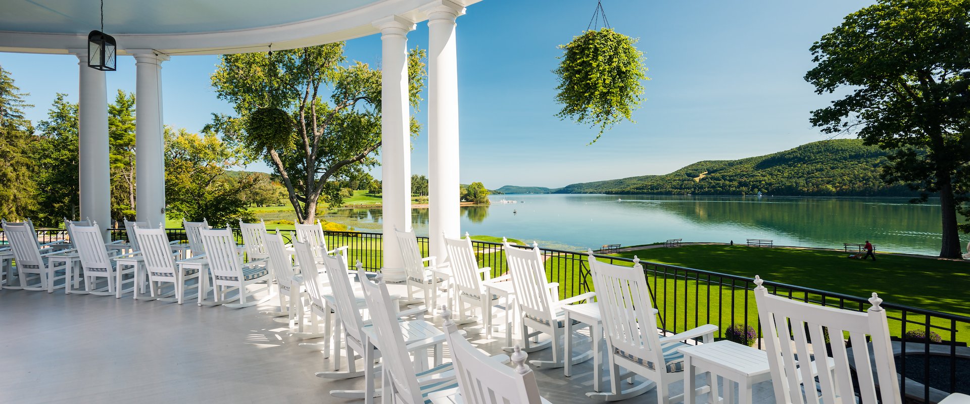White rocking chairs on the veranda of The Otesaga Resort Hotel, New York