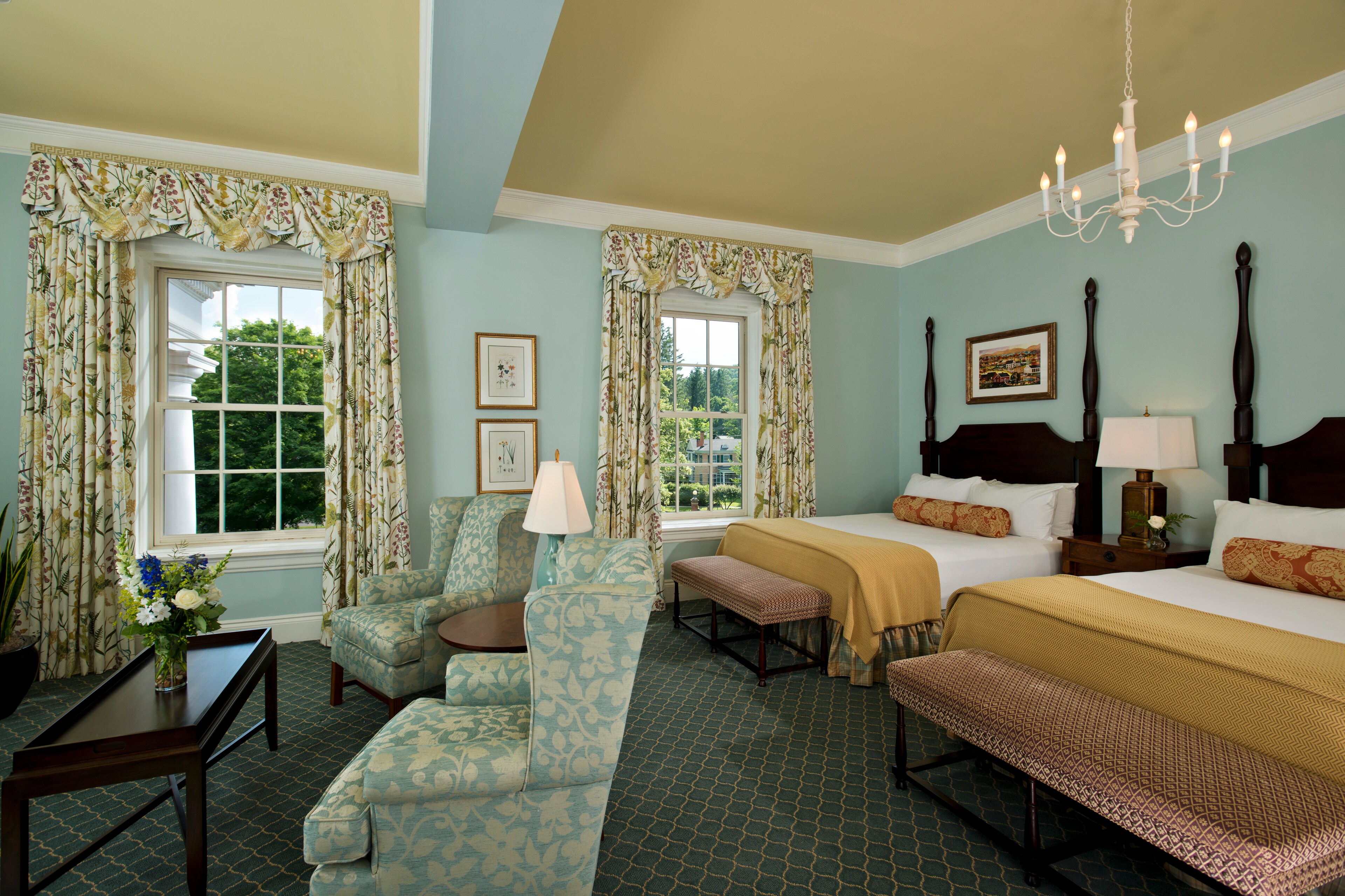 Grand Village Suite at The Otesaga Resort Hotel, New York, offering spacious living, elegant decor, and picturesque village views