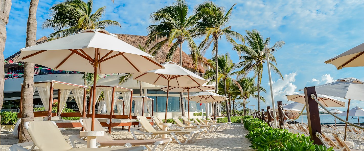 Relax at The Reef Coco Beach Resort & Spa in Playa Del Carmen's paradise.