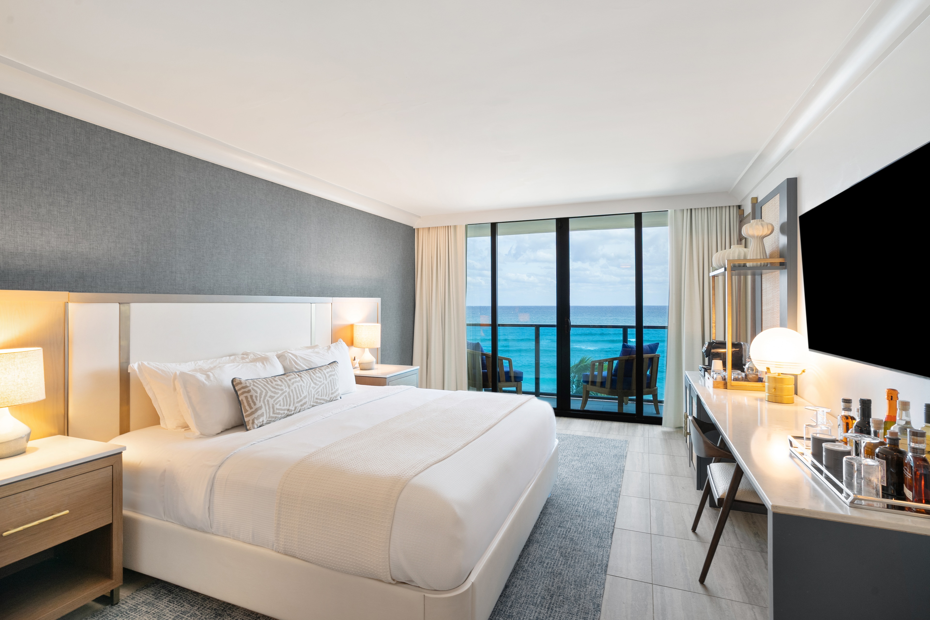 Luxurious bedroom with ocean views at Tideline Resort & Spa, Palm Beach, Florida