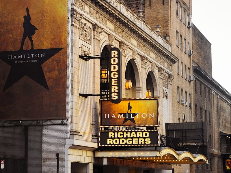 Hamilton posters over the entrance to the Richard Rogers theatre