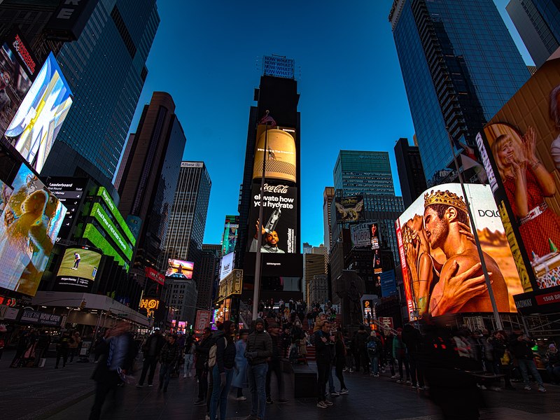 Times Square billboards at sunset