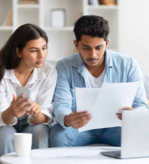 Couple reviewing their finances together for a consolidation loan