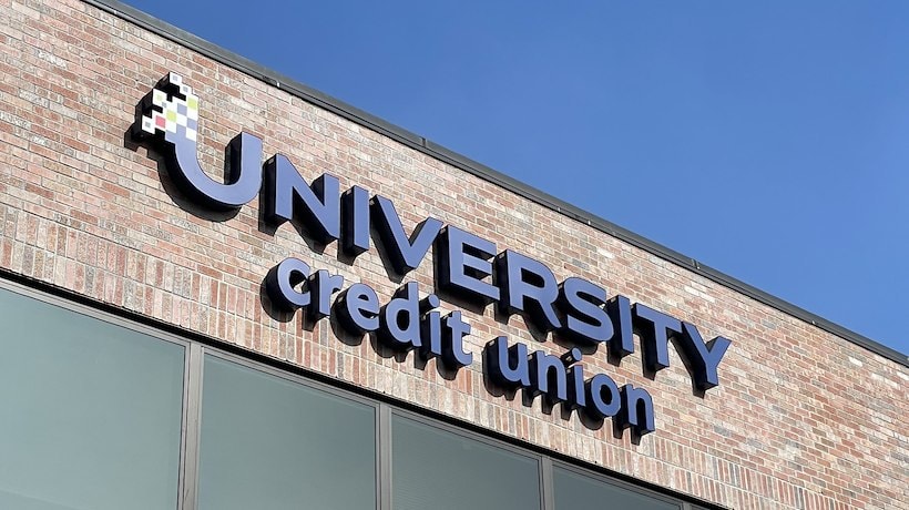 A sign on a brick building