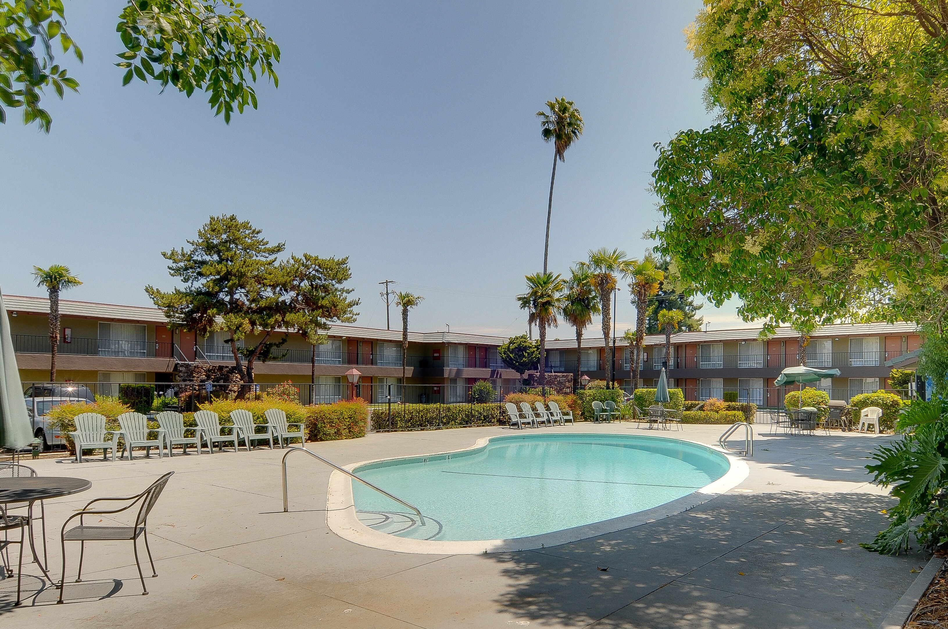 Swimming pool and seating area at Vagabond Inn - Sunnyvale