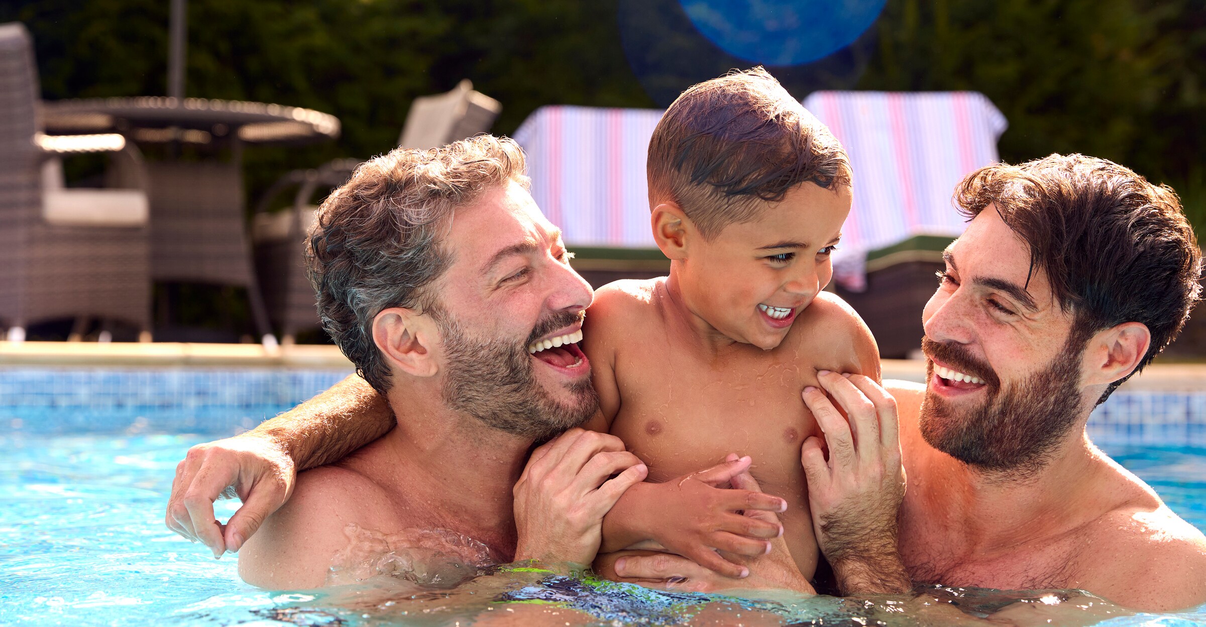Men and kid enjoying in pool at Whittier California