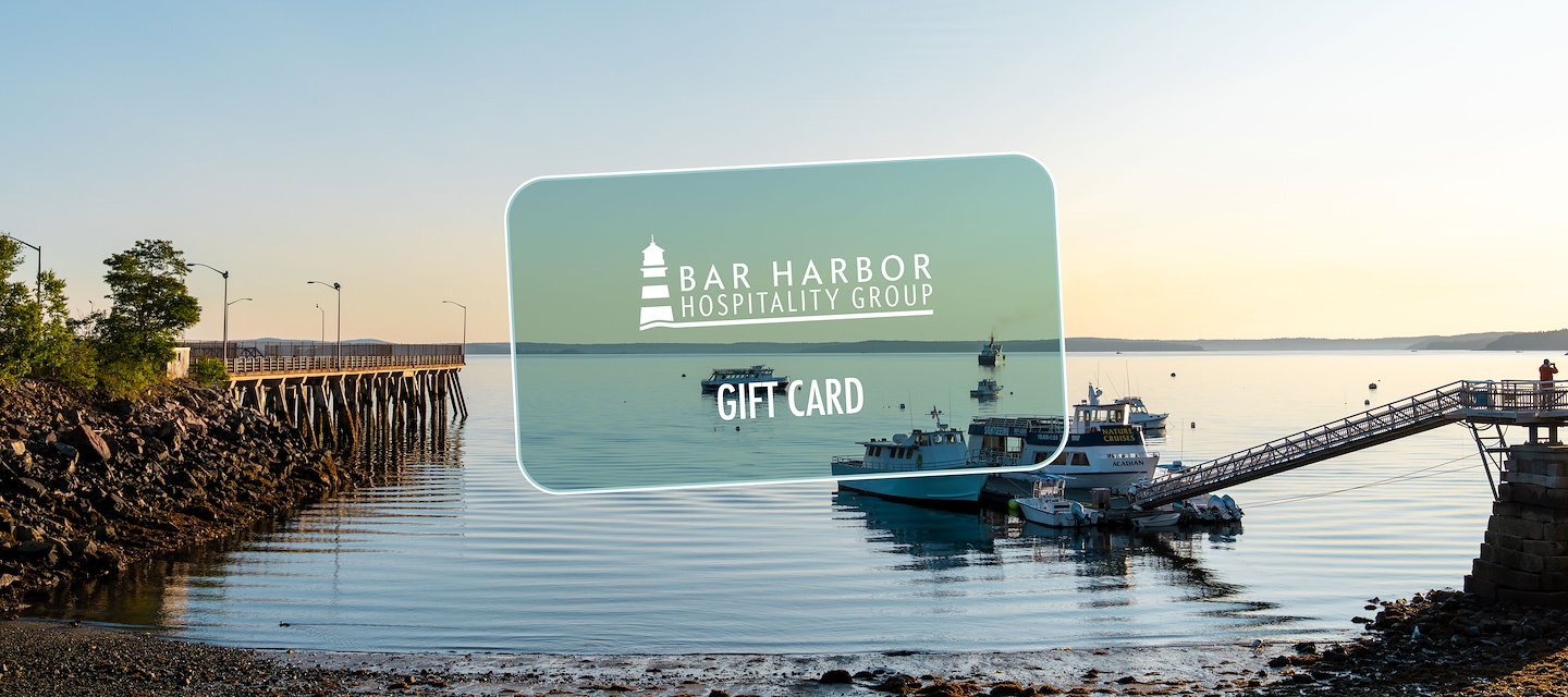 Beautiful view of the shoreline from the Atlantic Oceanside Hotel with a mock gift card in the center