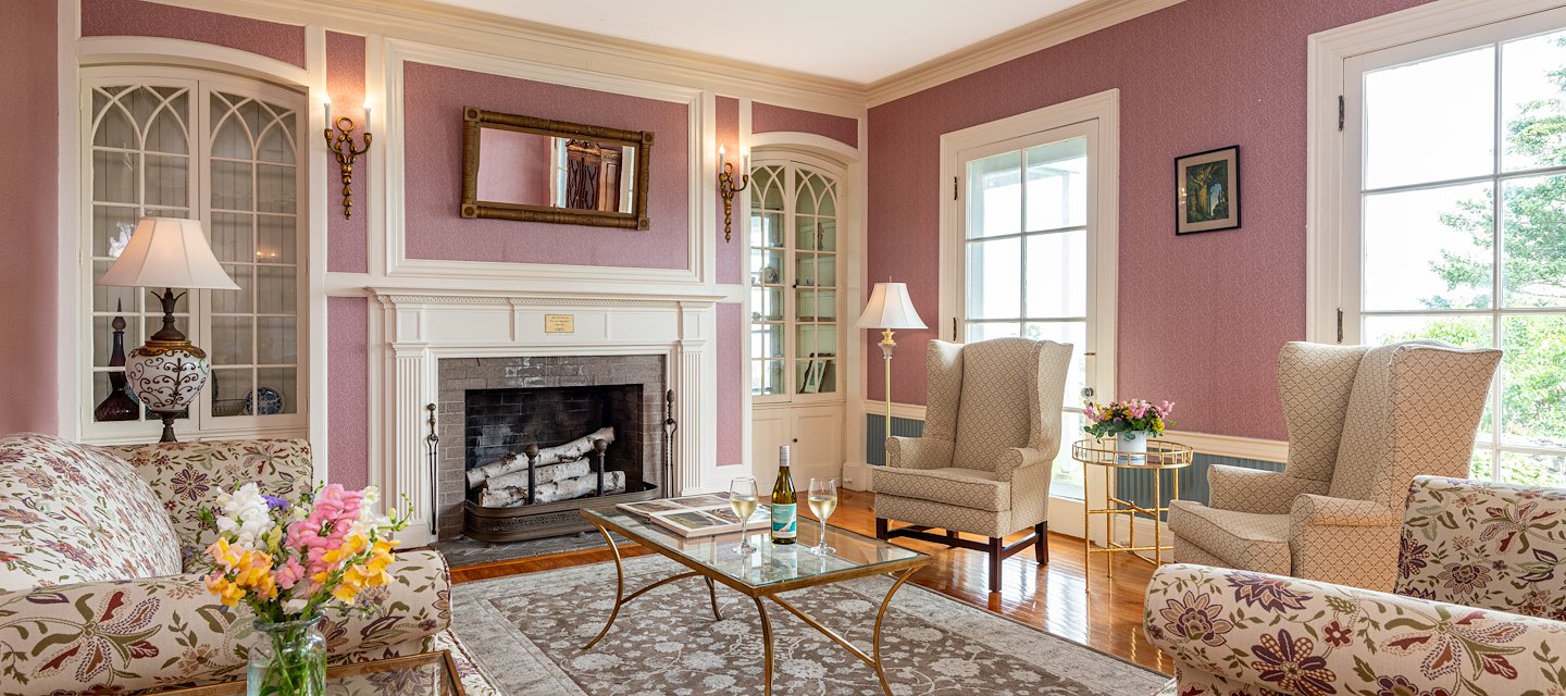 Elegant living room with pink walls and vintage decor