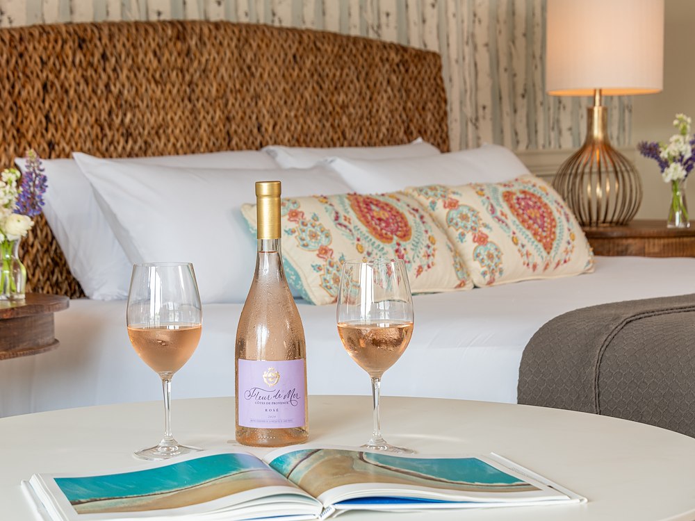 A cozy room at The Bayview Hotel, featuring wine and beautiful decor.