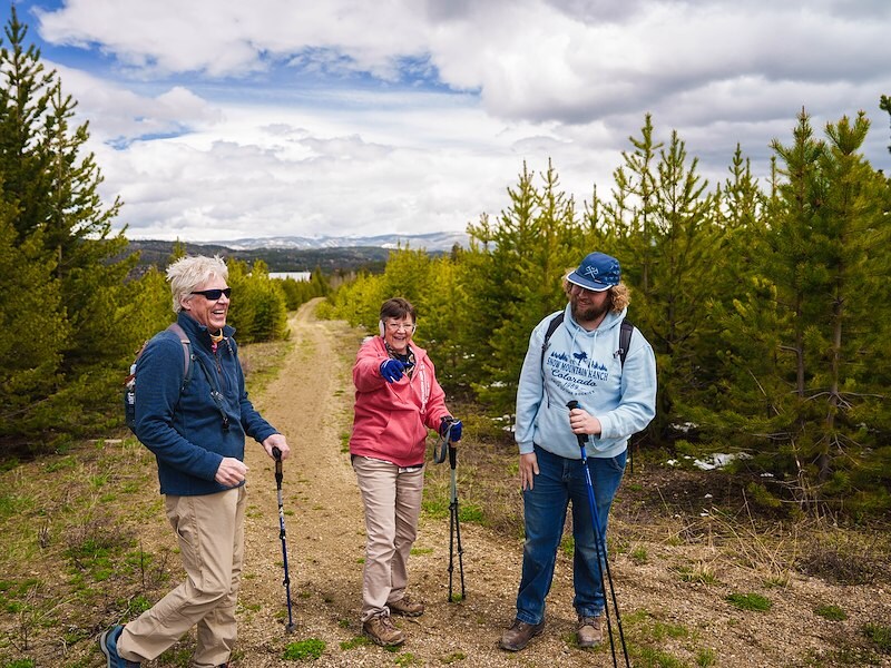 three people hiking