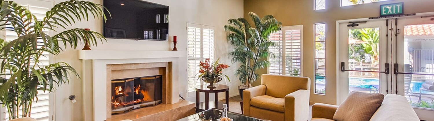 Living Room With Couches and A Fireplace at Escondido RV Resort Escondido, California