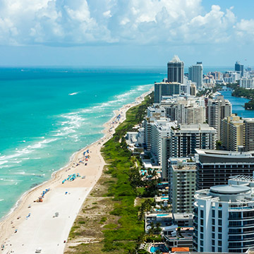 How far is Miami Beach from the Miami International Airport Hotel?